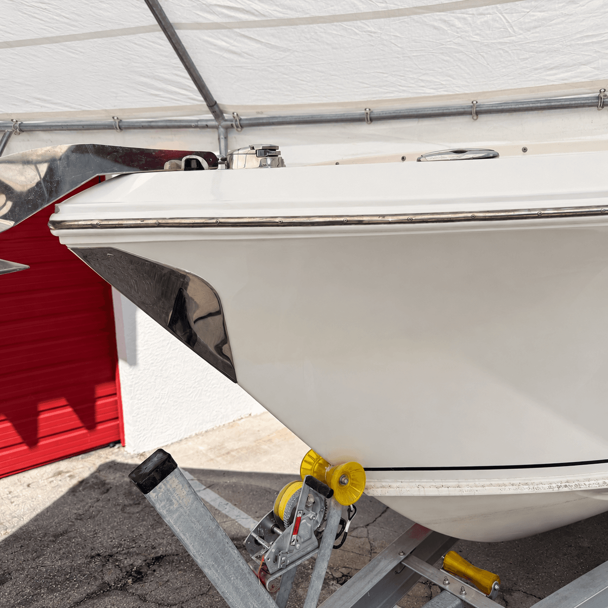 Close-up of a white fiberglass boat bow and gelcoat surface
